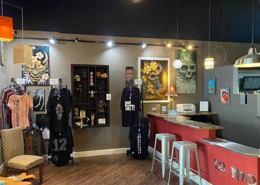 An image of the left side of the front of the studio, showing some merch for sale and some of the bar countertop.